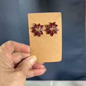 Vintage Avon Poinsettia earrings featuring red glitter enamel gold-tone metal
